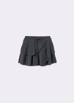 Falda corta volantes tejido estructura