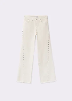 Pantalón corte lateral tachas