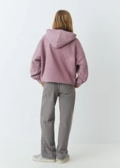 Pantalón tachas laterales